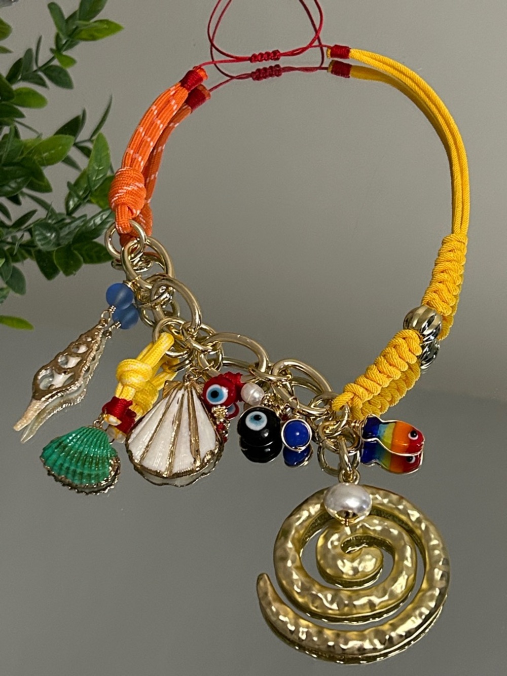 Gold Spiral Charm Necklace with Yellow & Orange Cord Accents